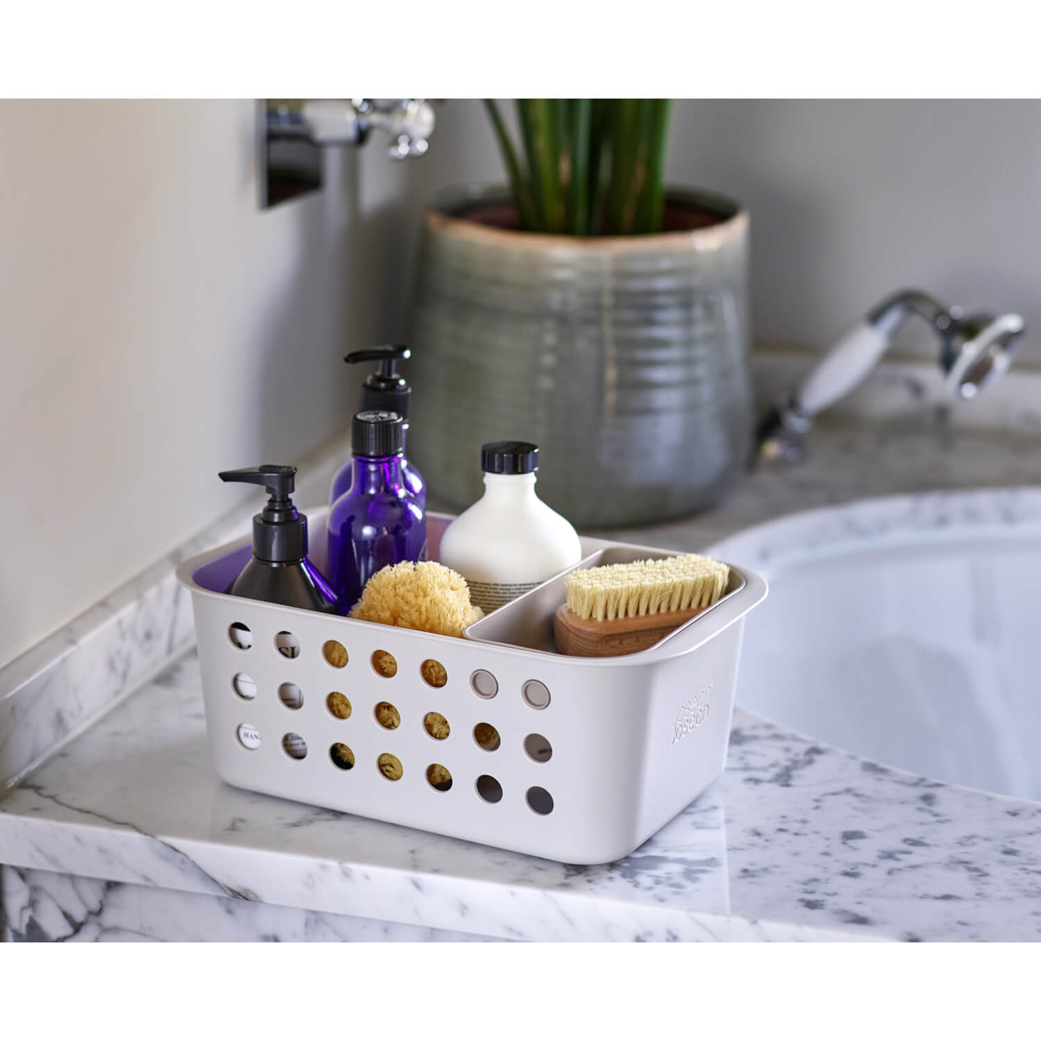 https://www.potterscookshop.co.uk/cdn/shop/files/70585-Joseph-Joseph-Easystore-Small-Bathroom-Storage-Basket-Ecru-Lifestyle-1.jpg?v=1683114624