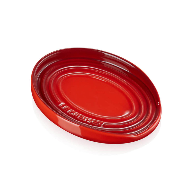 https://www.potterscookshop.co.uk/cdn/shop/products/71507150600099-Le-Creuset-Stoneware-Oval-Spoon-Rest-Cerise-Red-Main_800x.jpg?v=1661422295
